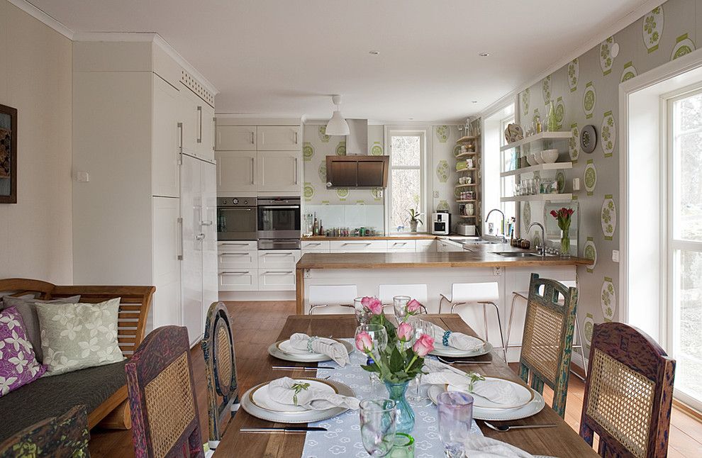 Removing Wallpaper Border for a Eclectic Kitchen with a Eat in Kitchen and Cat's House by Fotograf Lisbet Spörndly