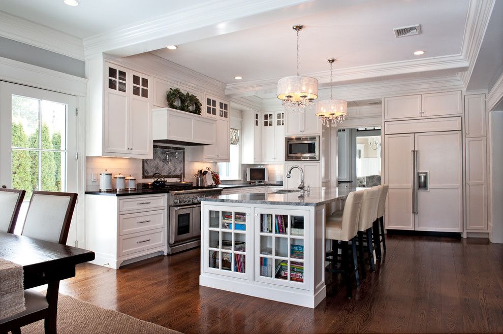 Renovator for a Traditional Kitchen with a Glass Front Bookshelves and Bartlet Renovation by Refined Renovations   the Style Refinery