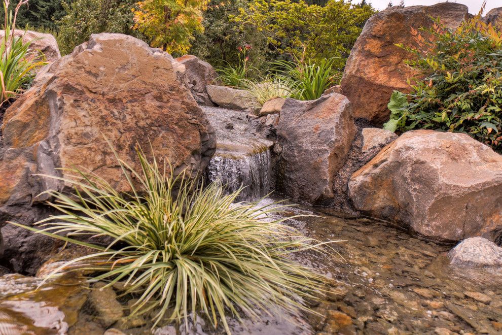 Restoration Hardware Portland for a Traditional Patio with a Gravel Patio and Dramatic Pond with Water Fall by Paradise Restored Landscaping & Exterior Design