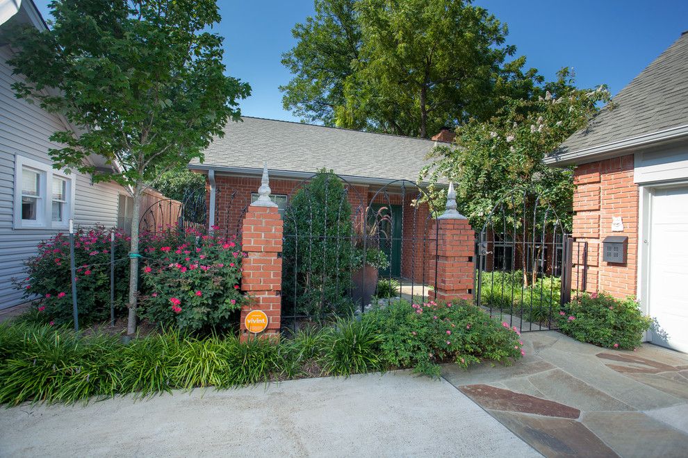 Roundtree for a Traditional Landscape with a River Rock and Lush Backyard Getaway by Roundtree Landscaping, Inc