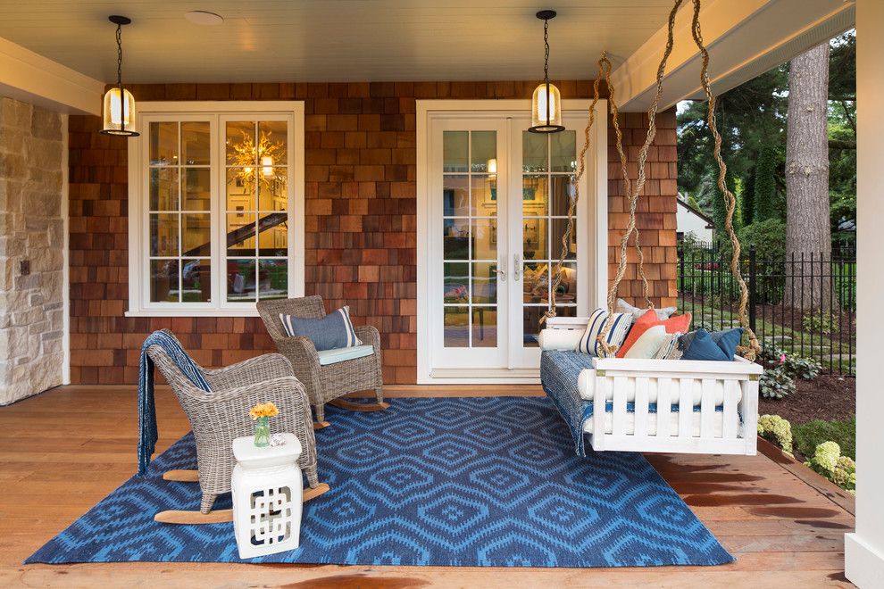 Sag Harbor Gym for a Beach Style Porch with a Porch Swing and Coastal Chic by Laura Engen Interior Design