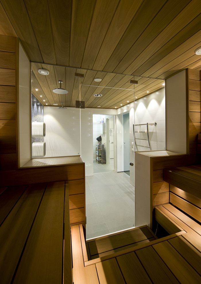 Sauna vs Steam Room for a Contemporary Bathroom with a Shower Room and Swimming Pool, Shower Room and Sauna Divided by Glass Doors by Decom Interiors