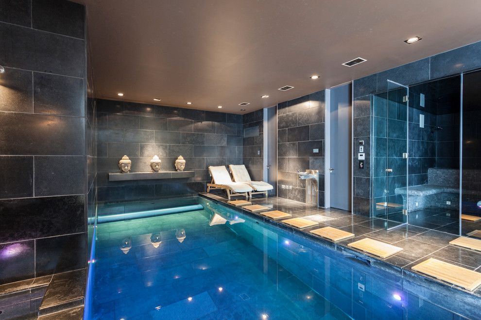 Sauna vs Steam Room for a Contemporary Pool with a Buddha Head and Wimbledon Mansion by Chris Snook