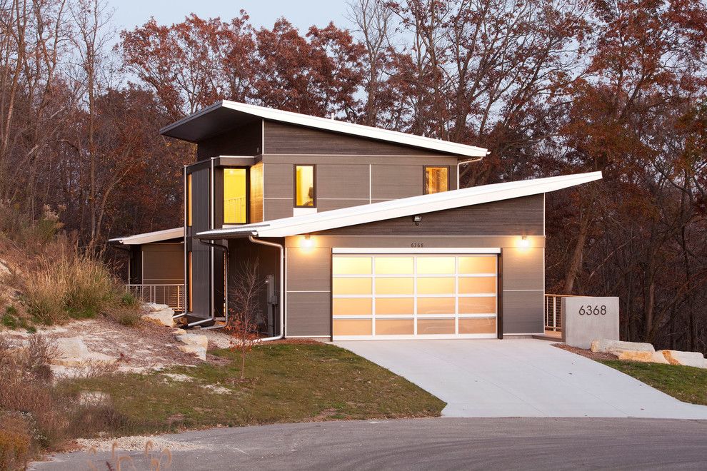 Scissor Doors for a Modern Exterior with a Mixed Siding and Zumbro Zen by Sala Architects