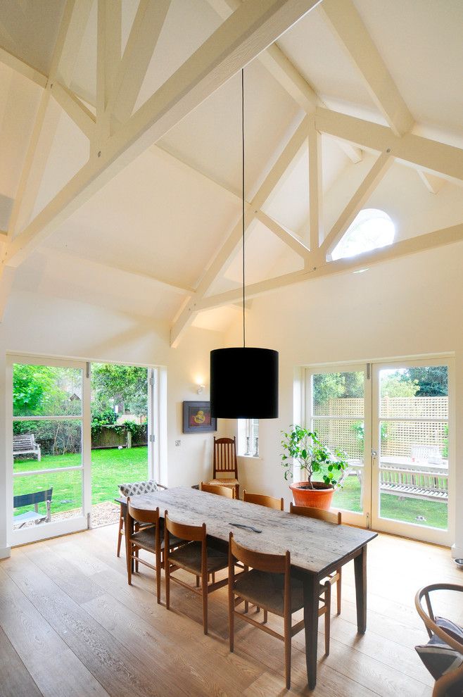 Scissor Doors for a Transitional Dining Room with a Terra Cotta Pot and North Oxford by Riach Architects