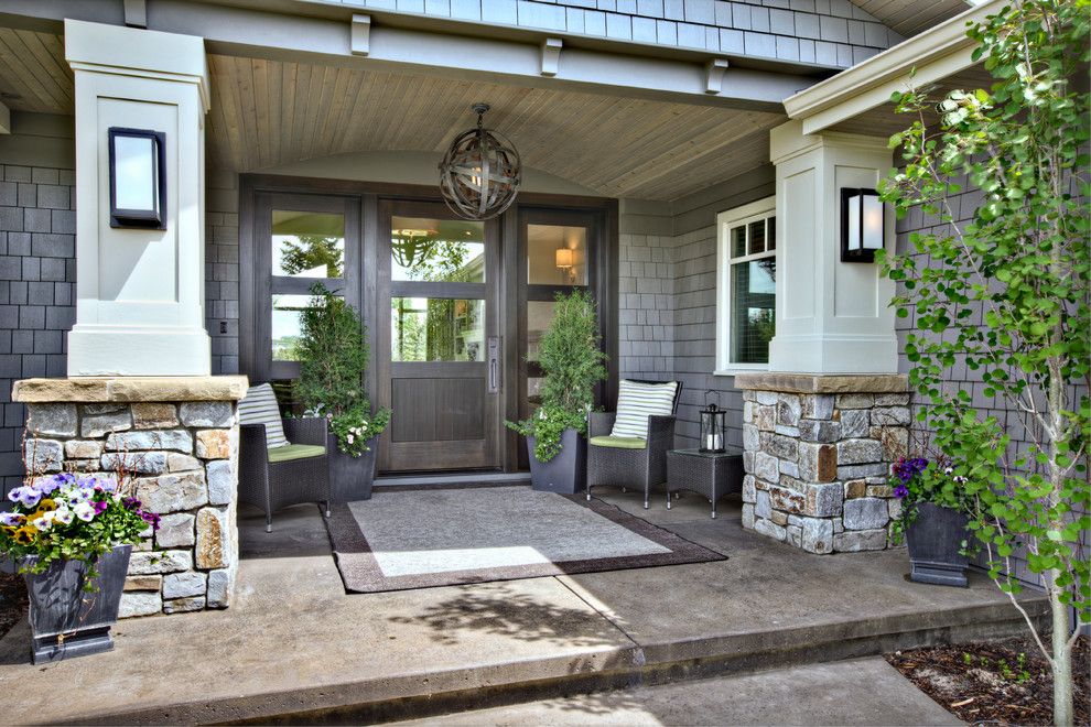 Sconces Definition for a Contemporary Porch with a Outdoor Furniture and Traditional Style at Its Best by Rockwood Custom Homes