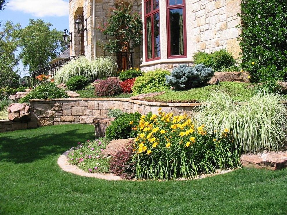 Scotts Lawn Service for a  Landscape with a Retainer Walls and Our Work by Sami's Landscape & Tree Service