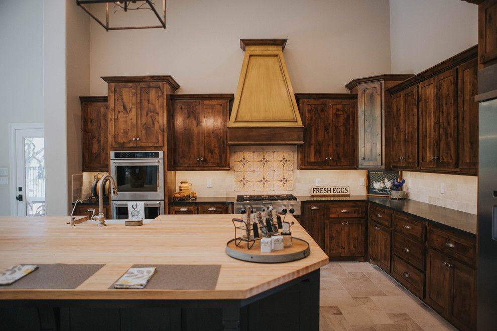 Sears San Angelo for a Farmhouse Kitchen with a Limestone Backsplash and San Angelo Farmhouse by Le Belle Maison Interiors Inc.