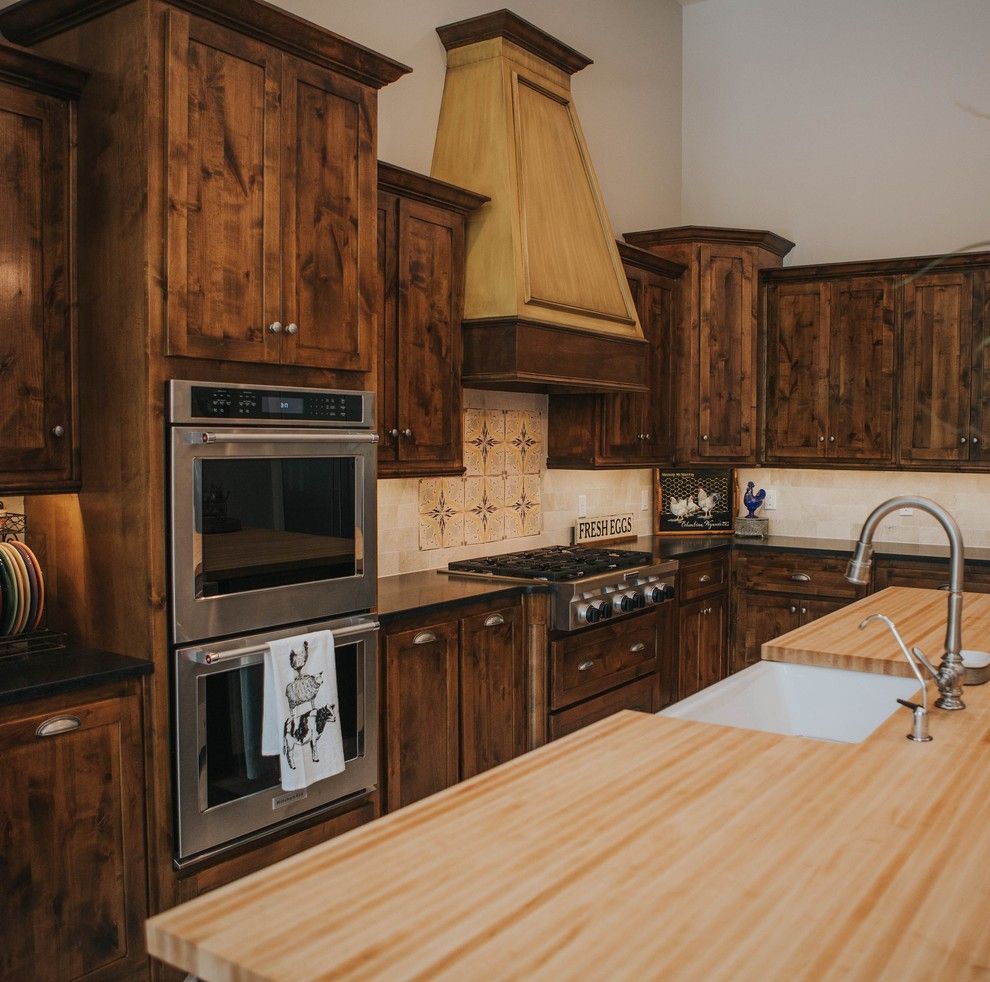 Sears San Angelo for a Farmhouse Kitchen with a Limestone Backsplash and San Angelo Farmhouse by Le Belle Maison Interiors Inc.