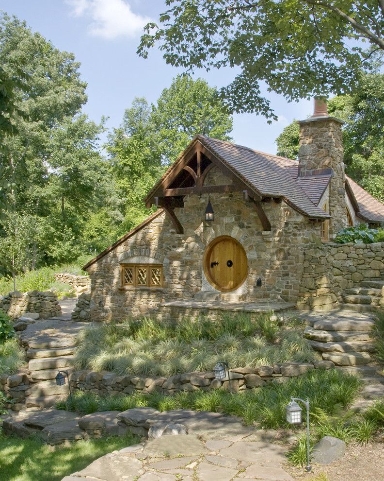 Shingles in Spanish for a Rustic Exterior with a Chimney and Hobbit House   Front View by Archer & Buchanan Architecture, Ltd.