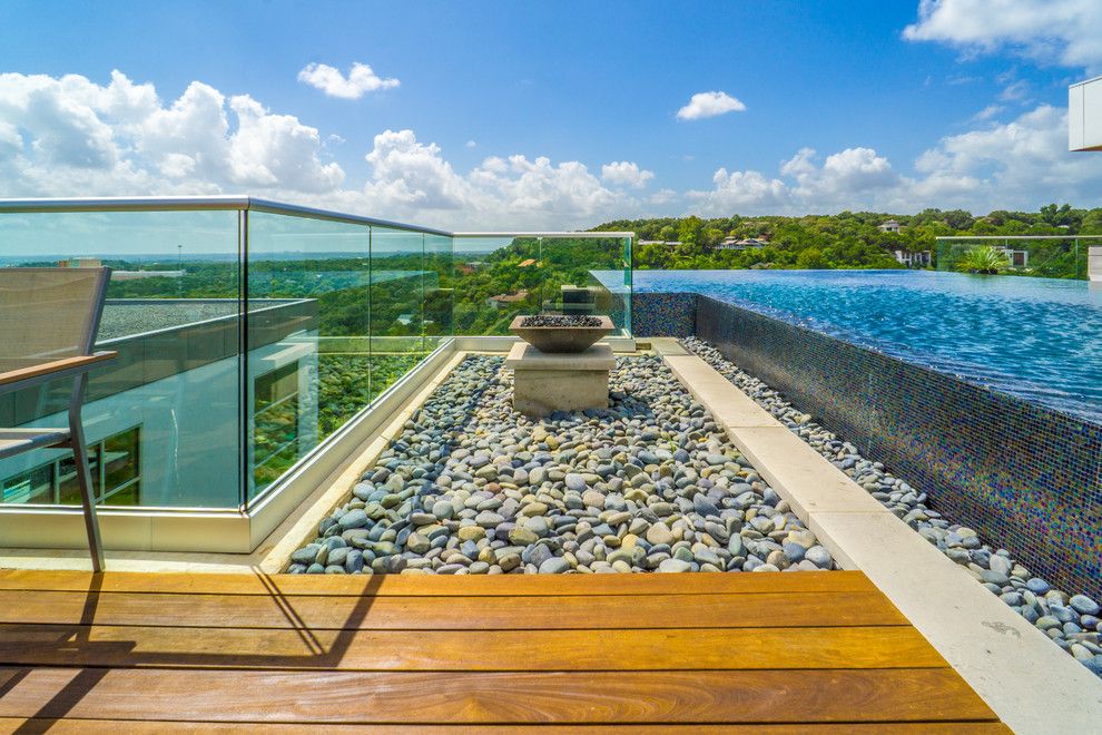 Simply Austin Furniture for a Modern Pool with a Pool with a View and West Lake Hills Infinity Edge Pool & Decks (Ipe, Cable Railing) by Timbertown