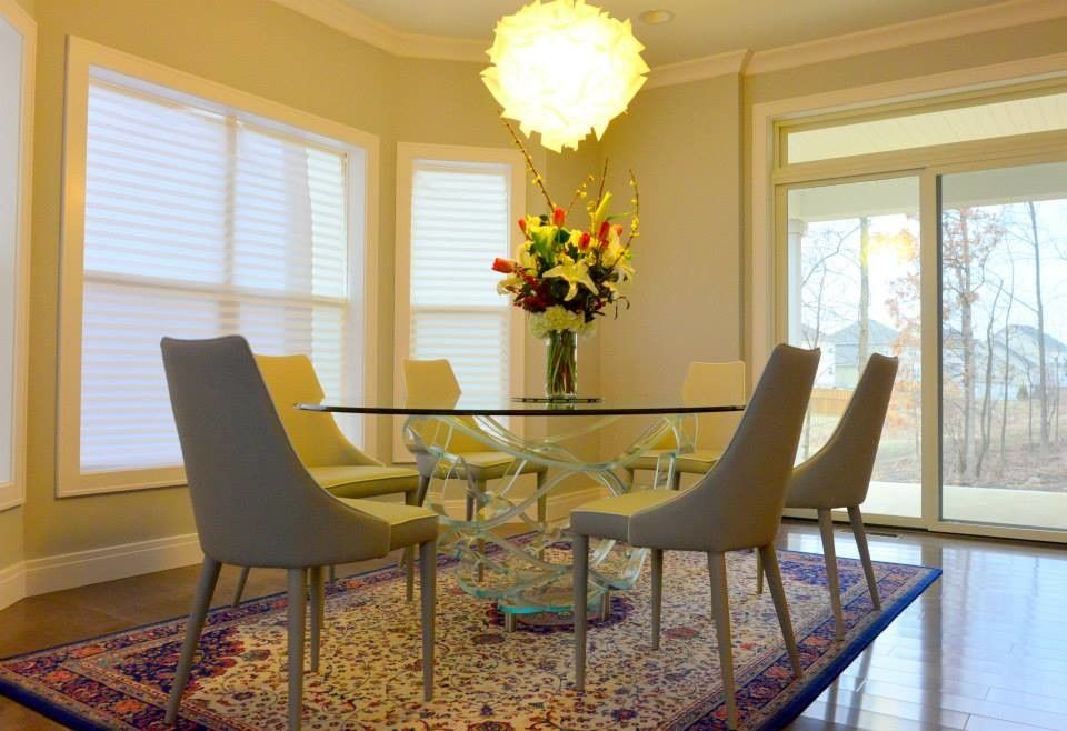 Slamp for a Contemporary Dining Room with a Round Dining Table and Luxe House in Urbana Champaign, Il by Iqmatics