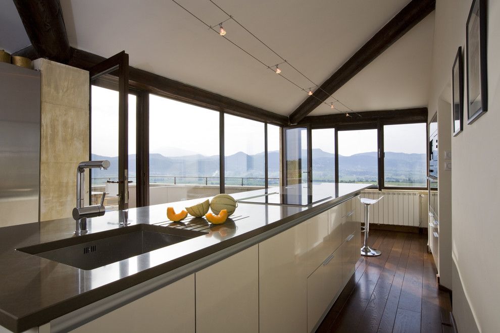 Slow Draining Sink for a Mediterranean Kitchen with a Kitchen Faucet and Kitchen by Ernesto Santalla Pllc