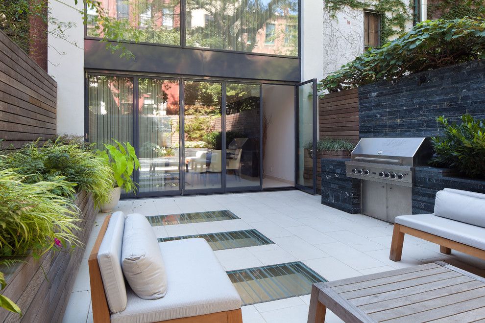 Solaire Apartments for a Contemporary Patio with a Privacy Wall and 67 Charles Street West Village by Travis Mark Photography