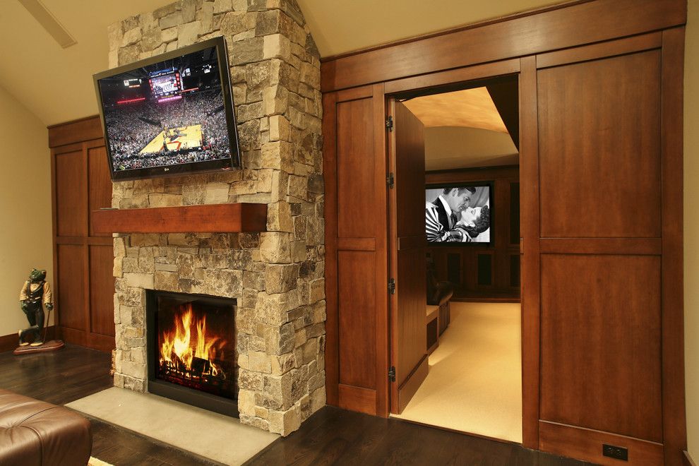 Soss for a Traditional Living Room with a Home Theater and Gentleman's Pub by Garrison Hullinger Interior Design Inc.