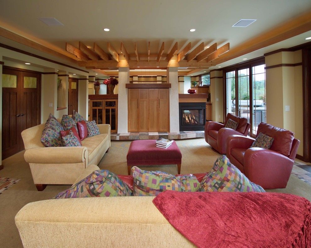 Soundbar vs Surround Sound for a Contemporary Basement with a 3 Side Fireplace and Prairie Inspired Lower Level by Jalin Design, Llc