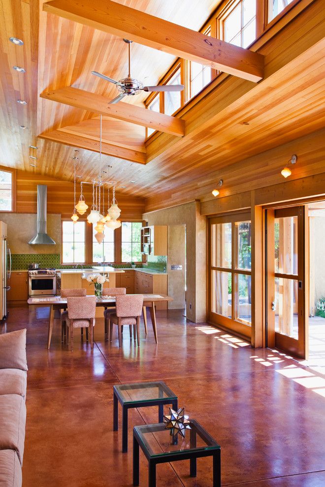 Southern Crushed Concrete for a Contemporary Living Room with a Wood Beam and Vine Hill Road Straw Bale Residence by Arkin Tilt Architects