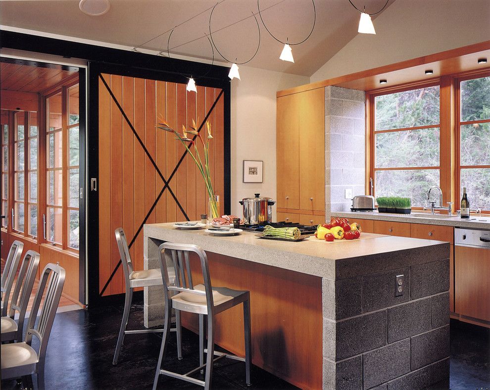 Southern Crushed Concrete for a Rustic Kitchen with a Concrete Island and Buchter Retreat by David Coleman / Architecture