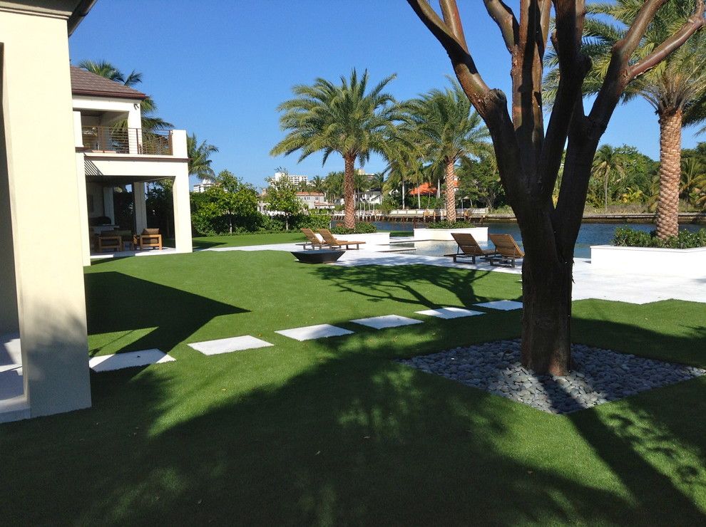 Southwest Greens for a Traditional Landscape with a Stone Pavers and Artificial Grass by Southwest Greens of Florida