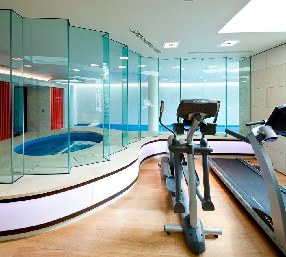 Spca New Orleans for a Modern Home Gym with a Safety Glass and Basement Pool in London by Design by Guncast