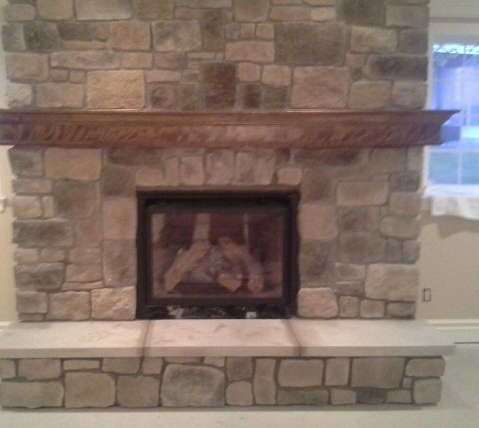 St Albans Mo for a Traditional Spaces with a Fireplaces in Chesterfield Missouri and Indoor Fireplace Built From Faux Stone in Chesterfield, Mo by Masterpiece Masonry