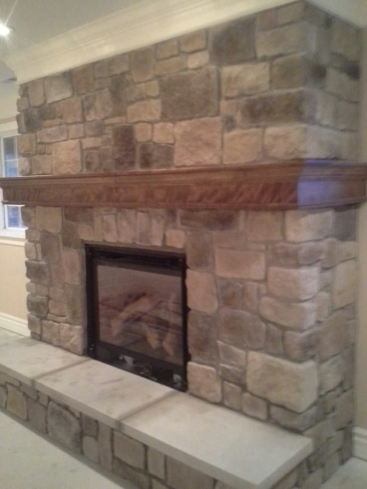 St Albans Mo for a Traditional Spaces with a Indoor Fireplaces Chesterfield Mo and Indoor Fireplace Built From Faux Stone in Chesterfield, Mo by Masterpiece Masonry