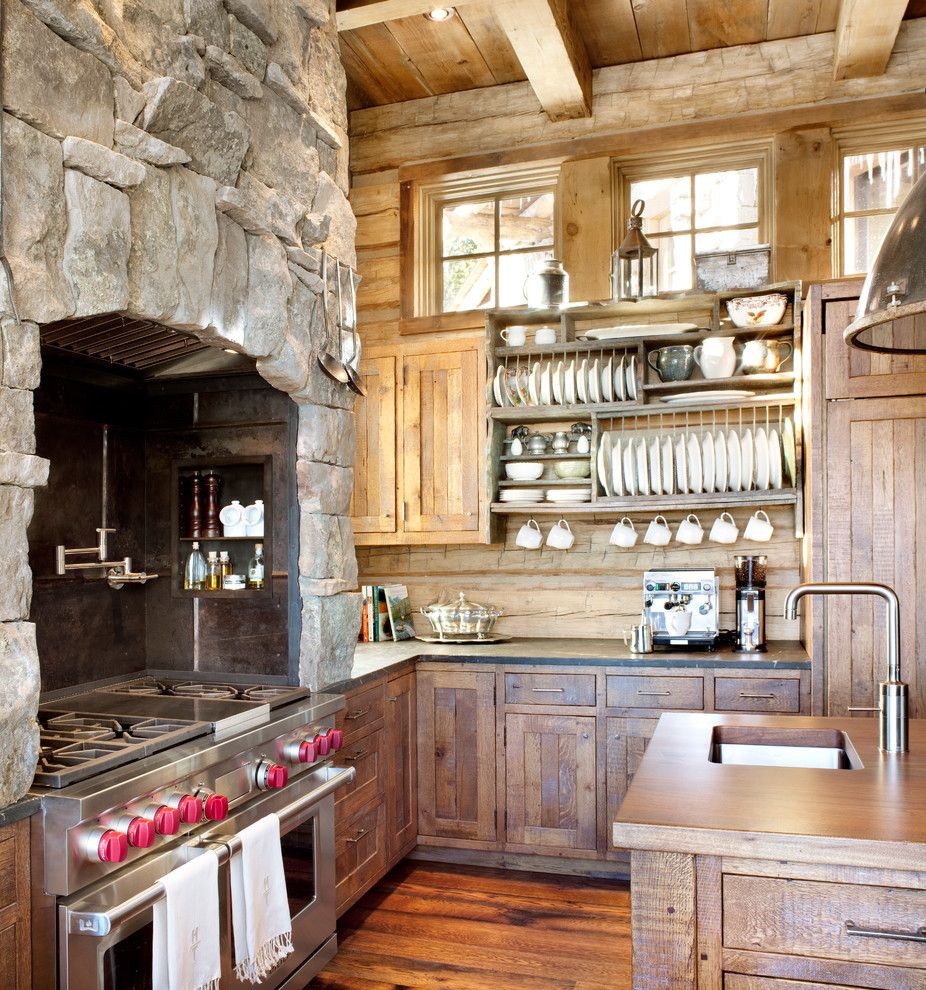 Stainless Steel vs Nonstick for a Rustic Kitchen with a Stone Range Hood and Kitchen by Peace Design