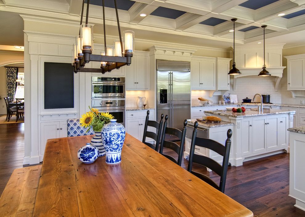 Stainless Steel vs Nonstick for a Traditional Kitchen with a Granite and Farinelli Construction Inc by Farinelli Construction, Inc.