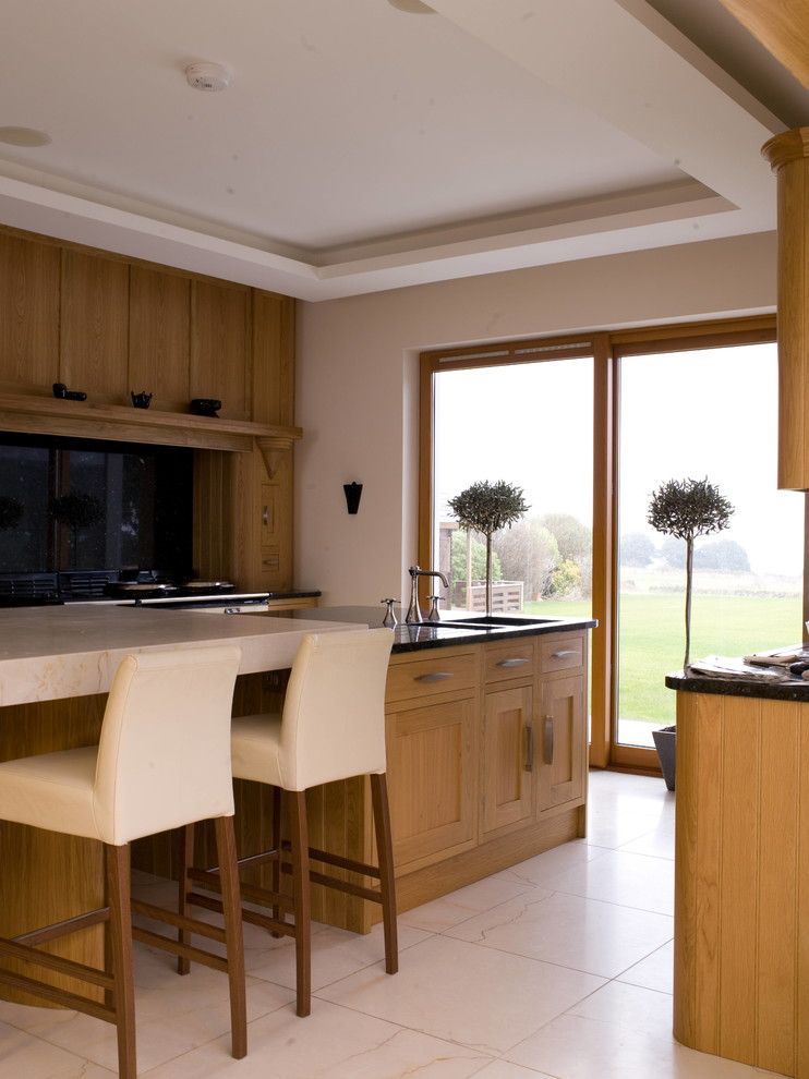 Standard Bar Stool Height for a Contemporary Kitchen with a Wood Drawers and Lumiere a La Mer by Ccd Architects