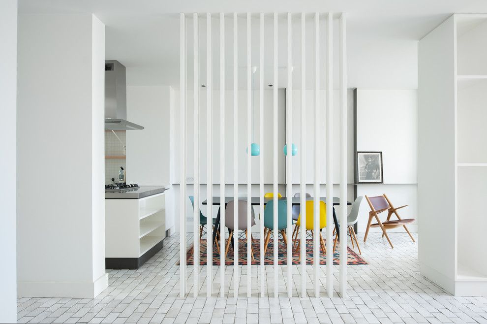 Stilnovo for a Transitional Dining Room with a Floor Tiles and Blue House by Azman Architects