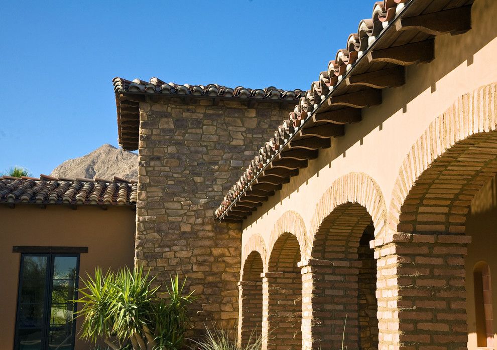 Sto Stucco for a Mediterranean Exterior with a Yellow and Rancho Mirage Villas by Sennikoff Architects, Inc.