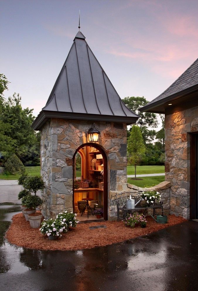 Storer House for a Traditional Shed with a Bark Mulch and Stone Lake House by Vanbrouck & Associates, Inc.