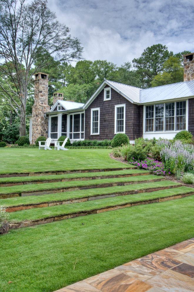 Suncoast Property Management for a Farmhouse Landscape with a Hillside Landscaping and From Pre Fab to Farmhouse by Historical Concepts