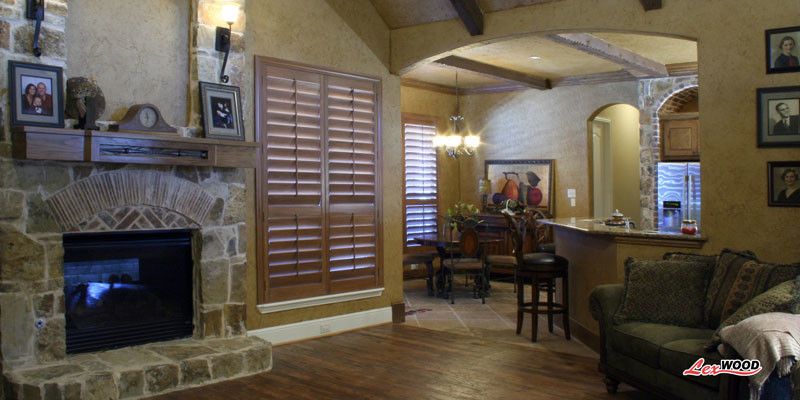 Sunland Shutters for a Contemporary Family Room with a Plantation Shutters and Sunland Stained by Expressions in Window Fashions