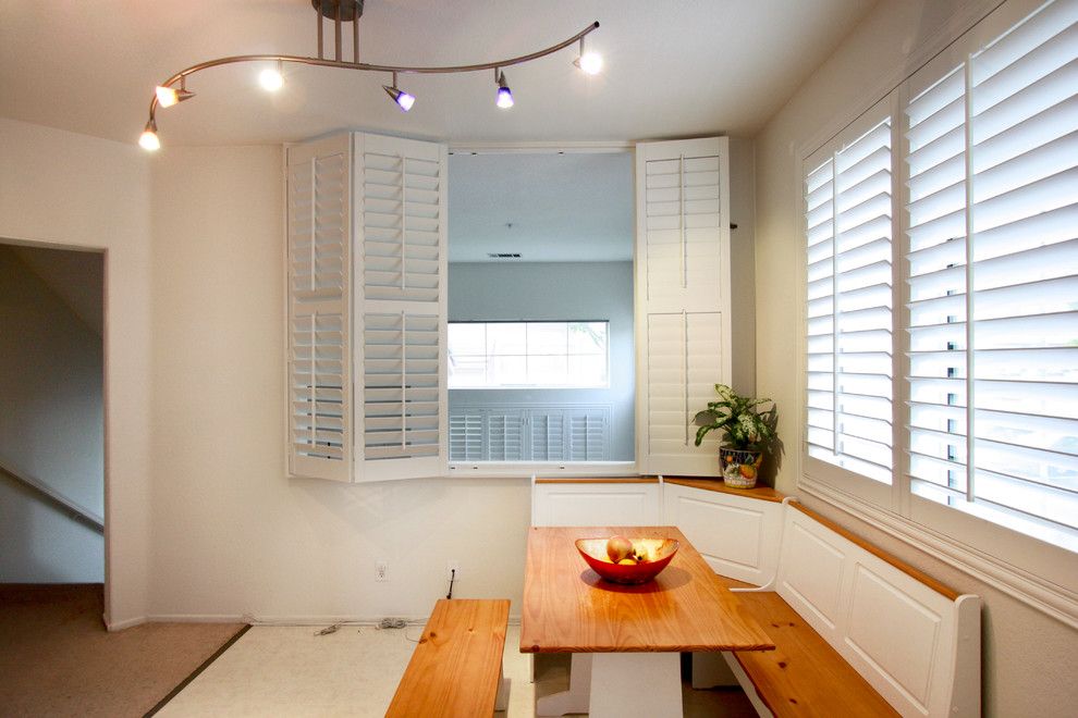 Sunland Shutters for a Traditional Kitchen with a Shutters and White Plantation Shutters by 3 Blind Mice Window Coverings, Inc.