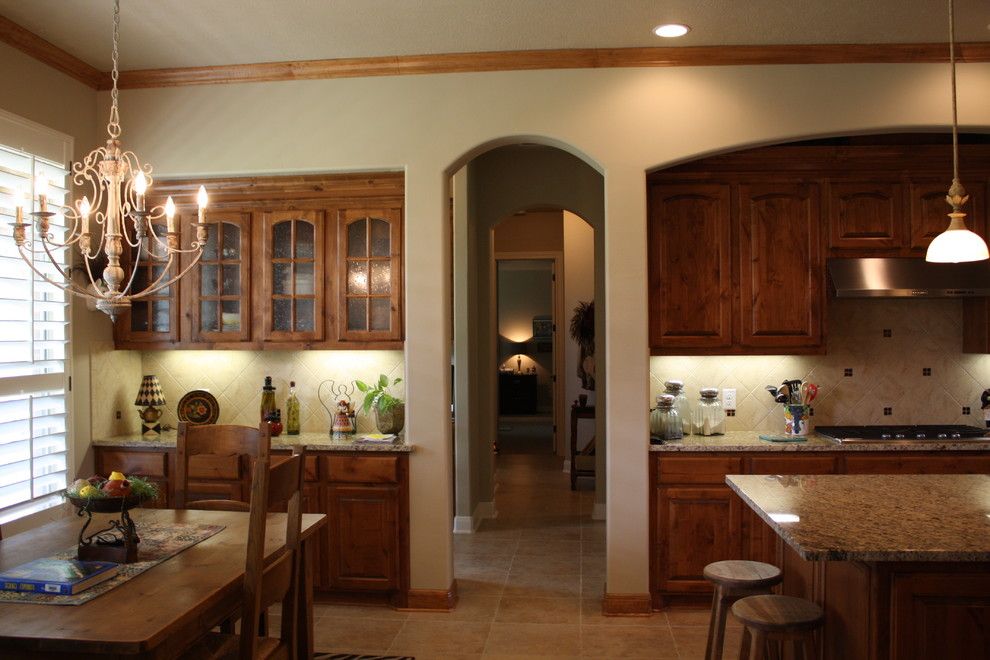 Sunnyvale Rod and Gun for a Traditional Kitchen with a Travertine and Gun and Rod by Mill Creek Custom Homes