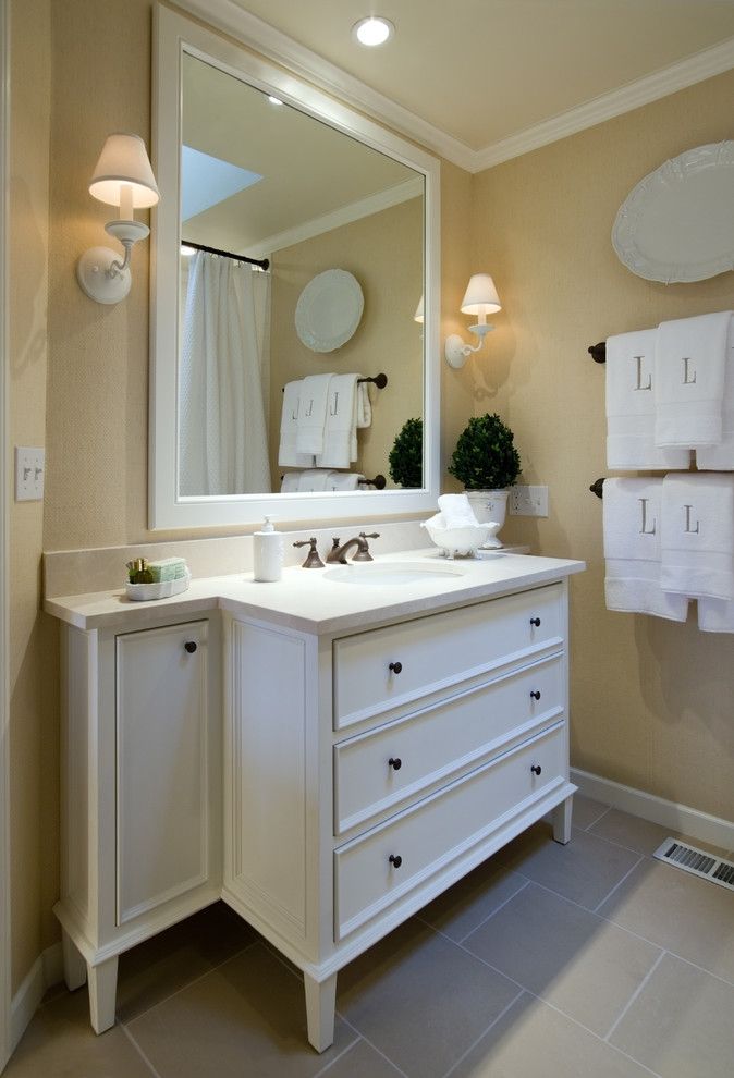 Sysco Guest Supply for a Traditional Bathroom with a Wall Lighting and Murrayhill Hall Bath by Rockwood Cabinetry