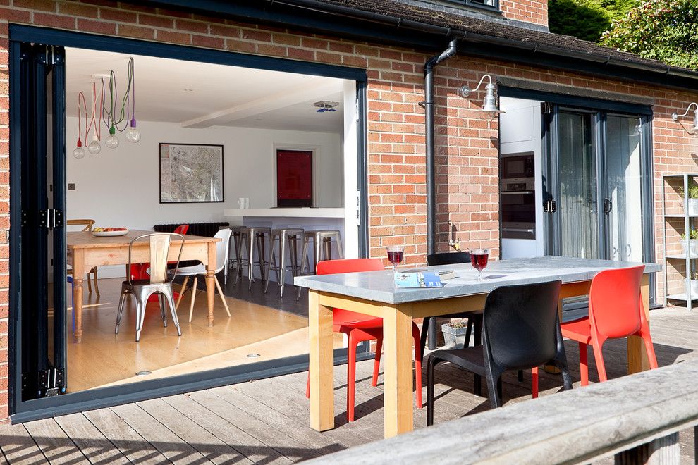 Table Shuffleboard Rules for a Contemporary Patio with a Kitchen and Wickets by Boutique Homes