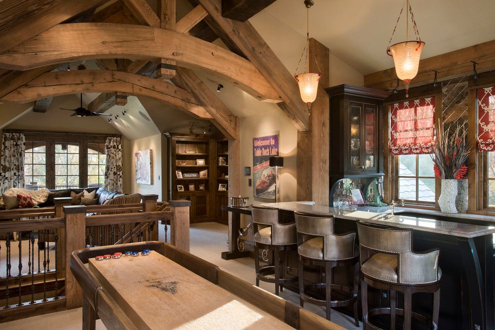 Table Shuffleboard Rules for a Rustic Family Room with a Wood Beams and Chimney Rock Residence by Locati Architects