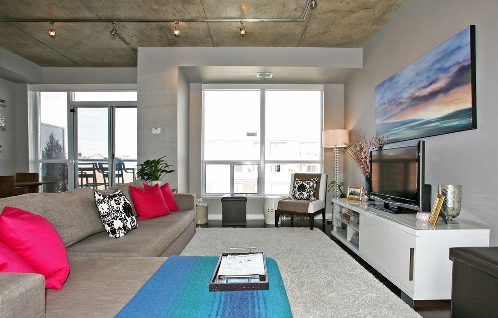 Tailor Lofts for a Contemporary Family Room with a Dark Brown Cabinet and King West Loft by High Street Design