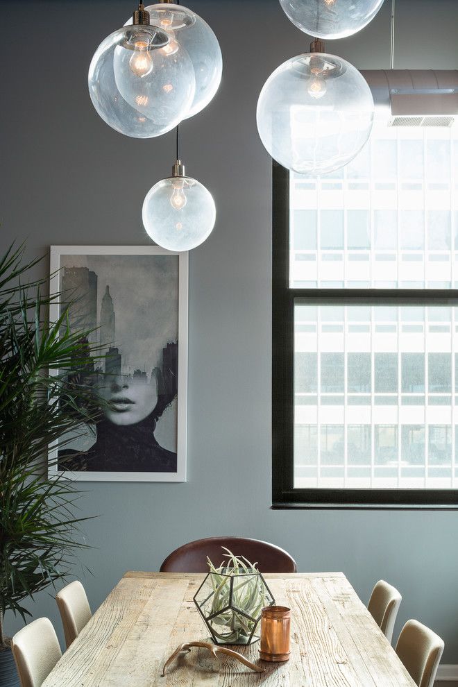 Tailor Lofts for a Industrial Dining Room with a High Ceilings and River North Loft by Haven Design Studio