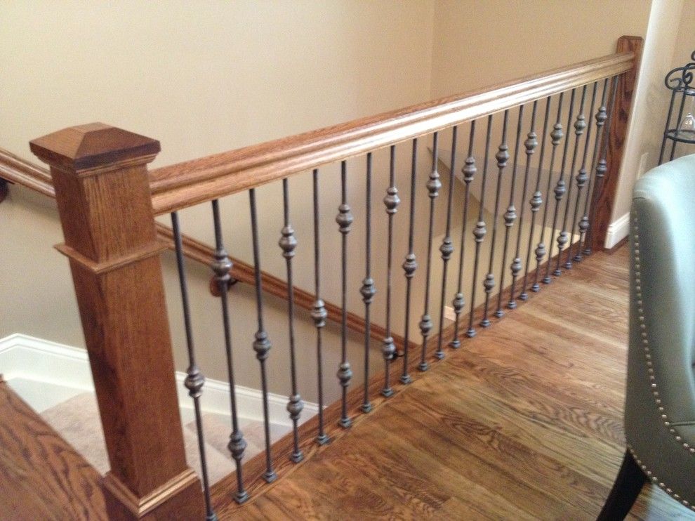 The Ashleys for a Traditional Staircase with a Box Newel with Wrought Iron Railing and Stair Railing Projects by Ashley Construction / Ashley Remodeling