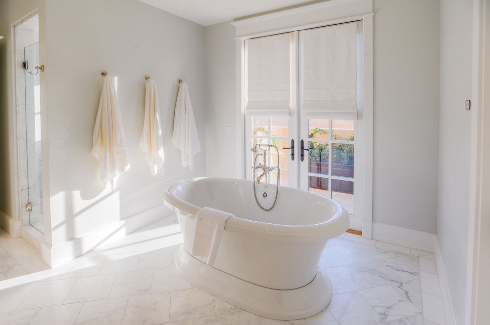 The Courts at Huntington Station for a Transitional Bathroom with a White Painted Wood and Desert Dwelling for Sports Enthusiasts | Master Tub by Drewettworks