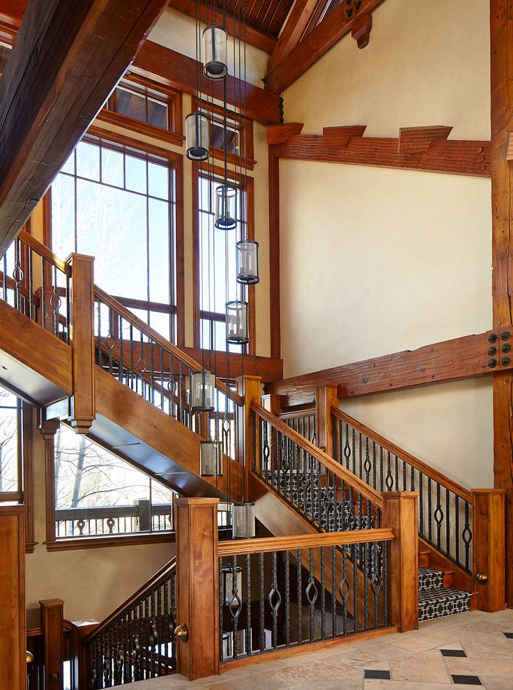 The Iron Giant Cast for a Rustic Staircase with a Wood Paneling and Renovated Mountain Retreat by Greenauer Design Group