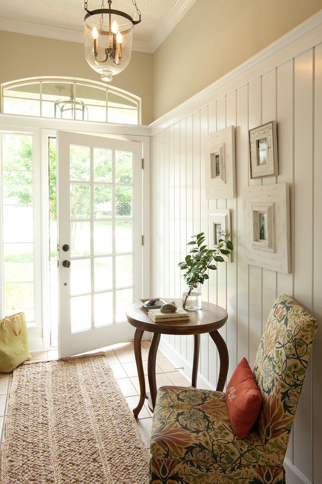 The Sanderling for a Beach Style Entry with a Pendant Light and Entry by Lauren Leonard Interiors