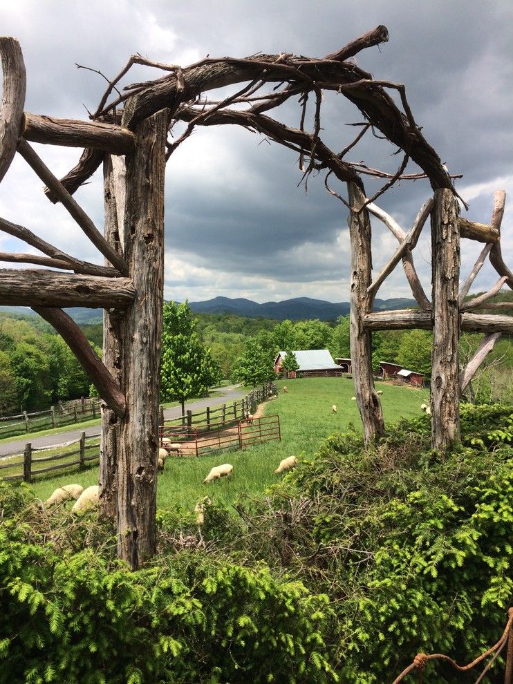 The Seasons Laurel Md for a Rustic Landscape with a Southern Style and a Rhododendron and Laurel Arch Overlooking a Southern Rose Garden by Dargan Landscape Architects