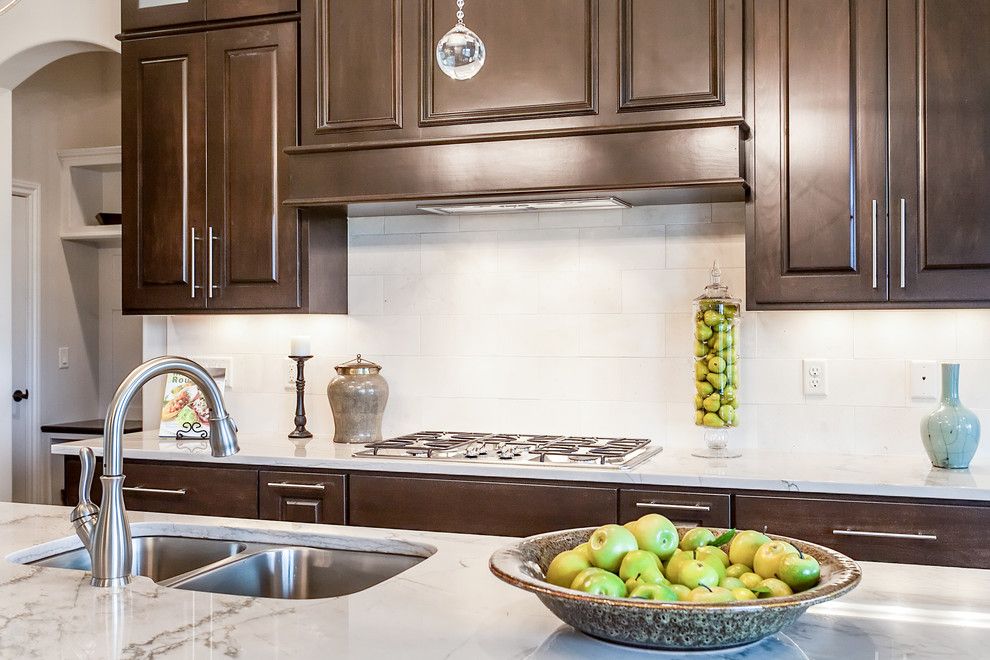 The Yard Wichita Ks for a Transitional Kitchen with a Range Hood and the Graystone   Wichita, Ks by Nies Homes