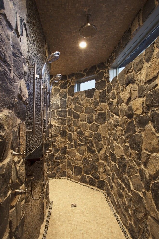 Tile and Stone Warehouse for a Traditional Bathroom with a Rain Shower and Bungalow Show Home in Springbank by Wolf Custom Homes Ltd.