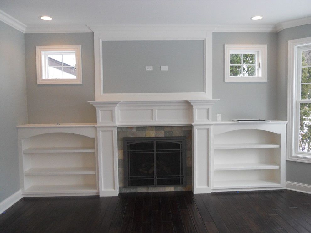 Tile Outlet Chicago for a Transitional Family Room with a Built in Bookshelves and Fireplace by Coora Construction Inc