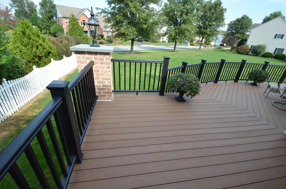 Timber Tech for a Traditional Deck with a Custom Brick Columns and Custom Timbertech Deck by Breyer Construction & Landscape